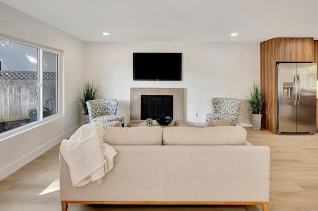 6745 Mewall Dr, San Diego, CA 92119 - living room featuring a premium fireplace, light wood finished floors, baseboards, and recessed lighting