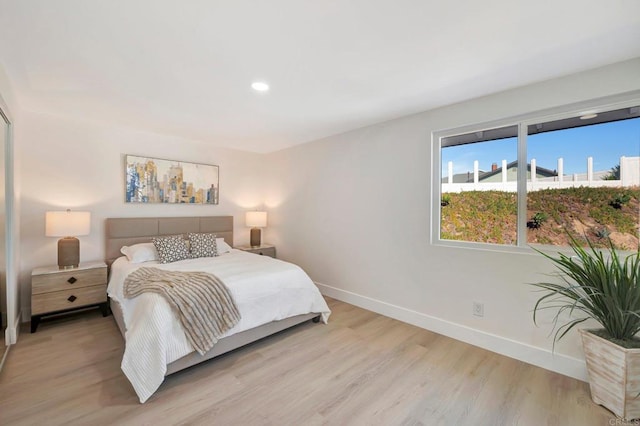 6745 Mewall Dr, San Diego, CA 92119 - bedroom featuring baseboards, light wood-style flooring, and recessed lighting