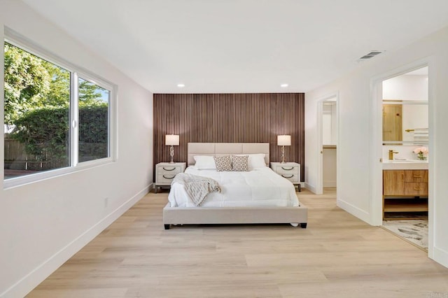 6745 Mewall Dr, San Diego, CA 92119 - bedroom with an accent wall, baseboards, light wood-style flooring, and recessed lighting