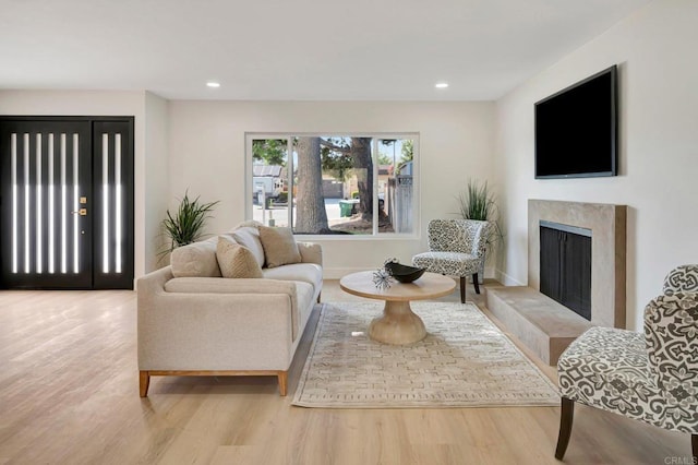 6745 Mewall Dr, San Diego, CA 92119 - living area featuring wood finished floors, recessed lighting, and a premium fireplace