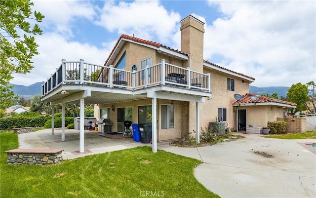 9979 Timbermist Ct, Rancho Cucamonga, CA 91737 - rear view of house featuring a chimney, a tiled roof, a patio area, and stucco siding