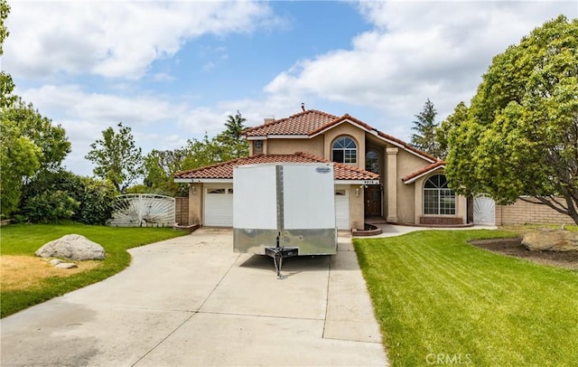 9979 Timbermist Ct, Rancho Cucamonga, CA 91737 - back of house with a tiled roof, driveway, a garage, stucco siding, and a gate