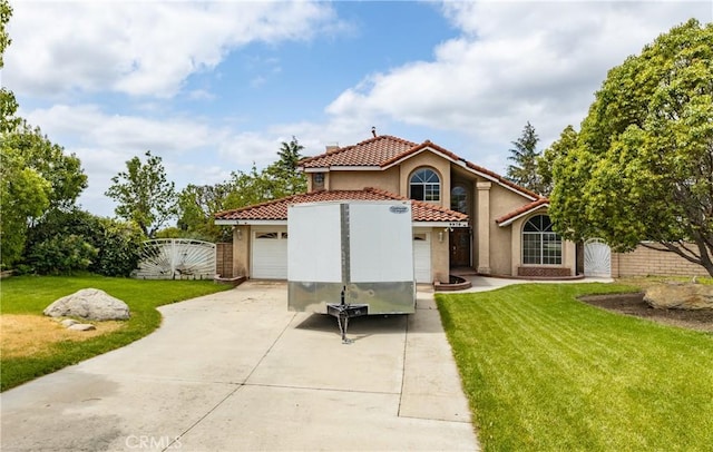9979 Timbermist Ct, Rancho Cucamonga, CA 91737 - view of front facade featuring a tiled roof, concrete driveway, a garage, stucco siding, and a gate