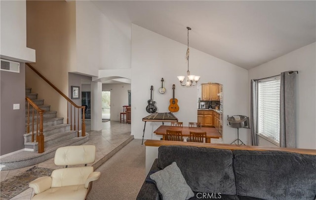 9979 Timbermist Ct, Rancho Cucamonga, CA 91737 - living area featuring arched walkways, a chandelier, stairs, and high vaulted ceiling