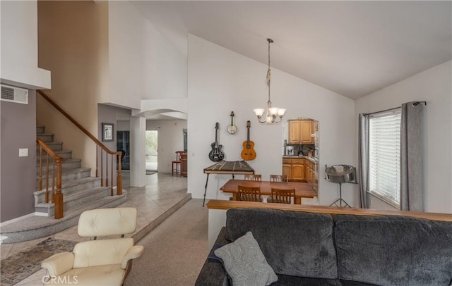 9979 Timbermist Ct, Rancho Cucamonga, CA 91737 - living area with arched walkways, a chandelier, stairway, and high vaulted ceiling