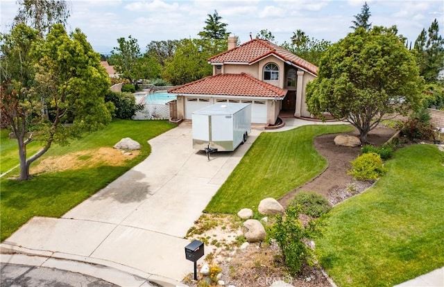 9979 Timbermist Ct, Rancho Cucamonga, CA 91737 - mediterranean / spanish-style house with a tiled roof, a chimney, driveway, stucco siding, and a front yard