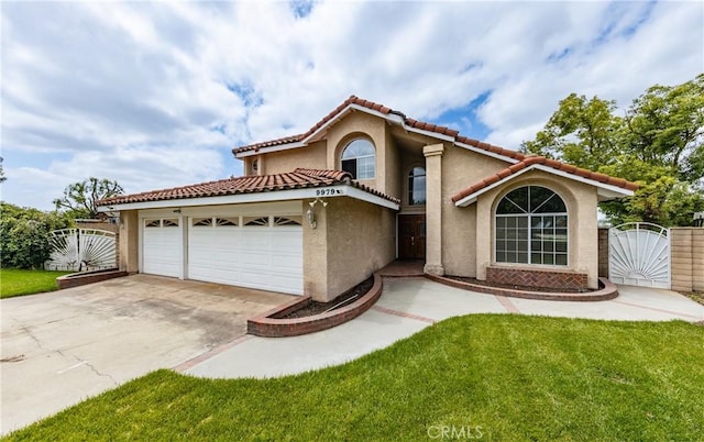 9979 Timbermist Ct, Rancho Cucamonga, CA 91737 - mediterranean / spanish-style house featuring a gate, stucco siding, driveway, and a garage
