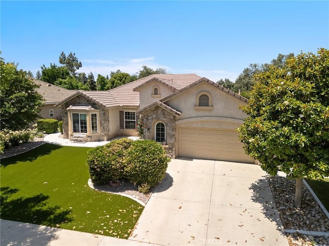 2403 Crocus Dr, Bakersfield, CA 93311 - view of front of property featuring stone siding, concrete driveway, a garage, stucco siding, and a front yard