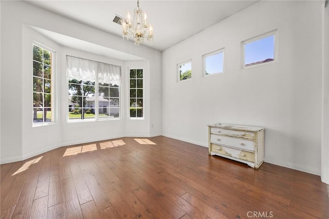 2403 Crocus Dr, Bakersfield, CA 93311 - unfurnished room with a chandelier, hardwood / wood-style floors, and healthy amount of natural light