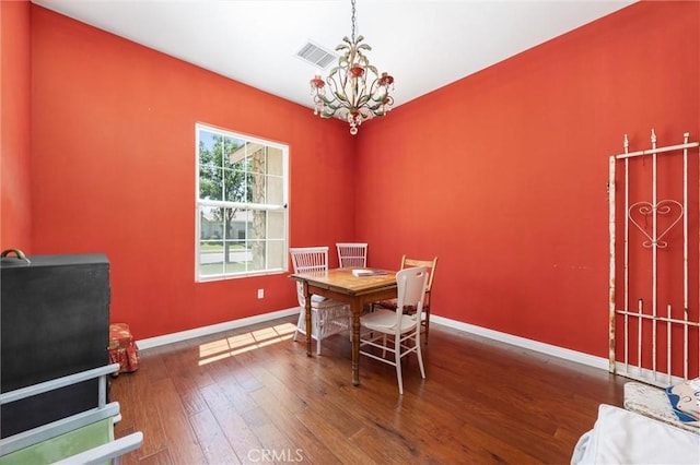 2403 Crocus Dr, Bakersfield, CA 93311 - dining room with a chandelier, wood-type flooring, and baseboards