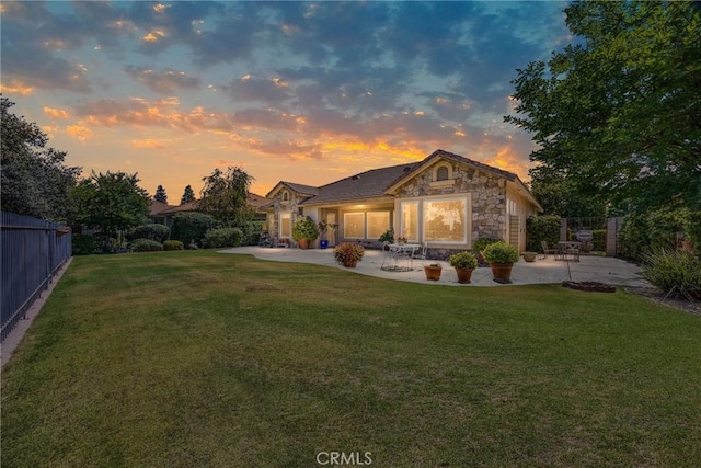 2403 Crocus Dr, Bakersfield, CA 93311 - yard at dusk featuring a patio