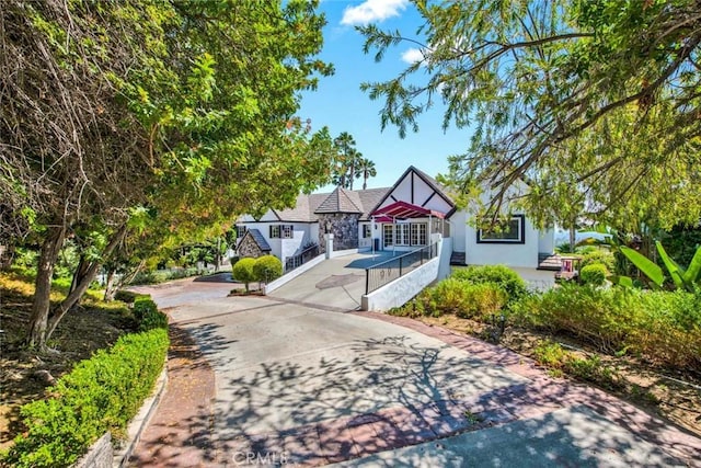 1532 Kensing Ln, North Tustin, CA 92705 - tudor home with driveway and stucco siding