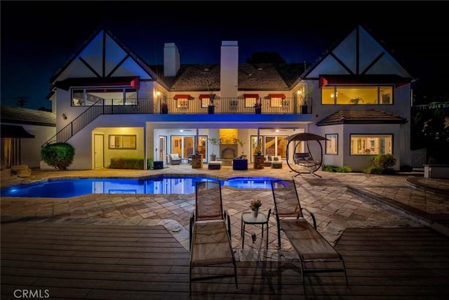1532 Kensing Ln, North Tustin, CA 92705 - pool at twilight with stairway, an outdoor pool, and a patio area