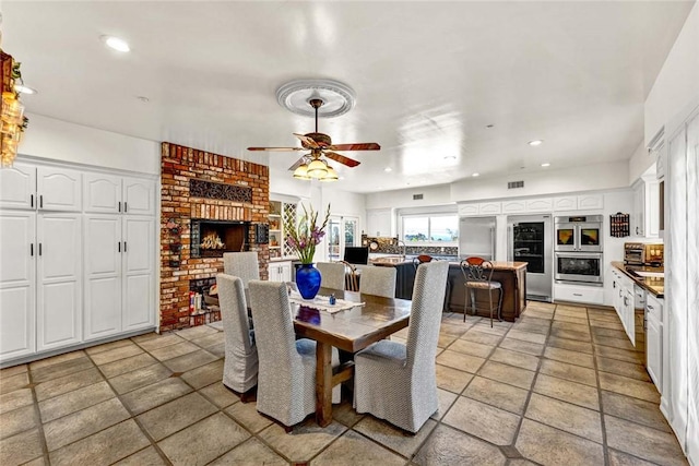 1532 Kensing Ln, North Tustin, CA 92705 - dining area featuring ceiling fan, wine cooler, recessed lighting, and a fireplace