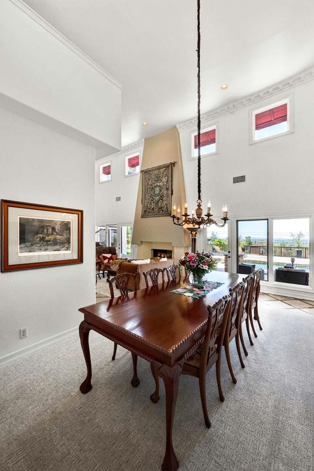 1532 Kensing Ln, North Tustin, CA 92705 - dining space featuring light carpet, a chandelier, and a high ceiling