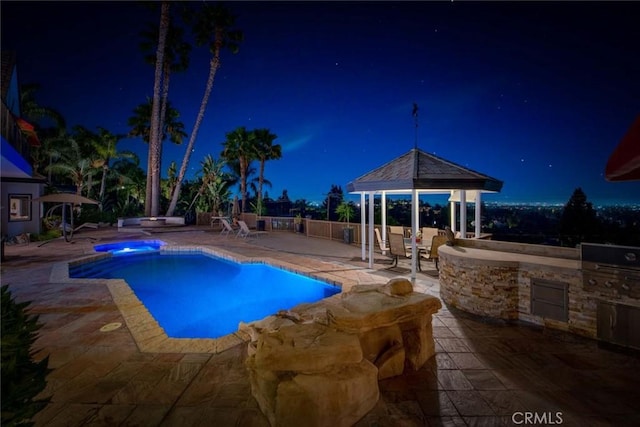 1532 Kensing Ln, North Tustin, CA 92705 - pool at twilight with a gazebo, an outdoor kitchen, a patio area, and a pool with connected hot tub