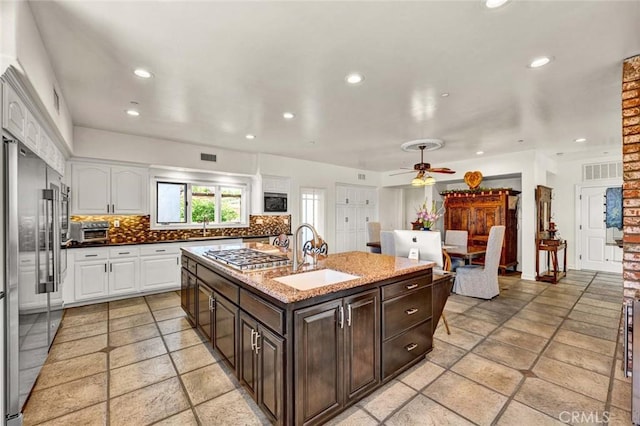 1532 Kensing Ln, North Tustin, CA 92705 - kitchen featuring a sink, stainless steel appliances, white cabinetry, backsplash, and recessed lighting