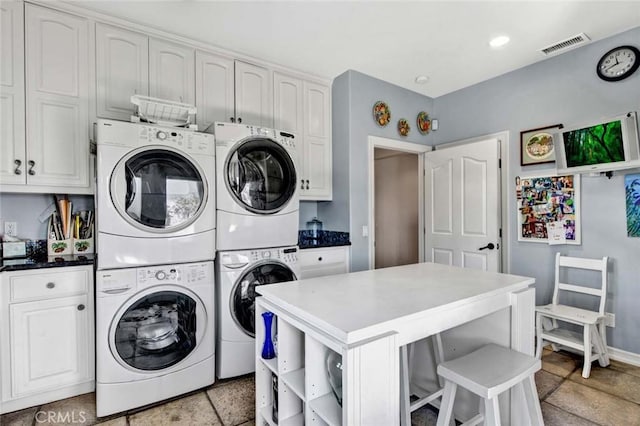 1532 Kensing Ln, North Tustin, CA 92705 - laundry room with cabinet space, washing machine and dryer, stacked washer / drying machine, and baseboards