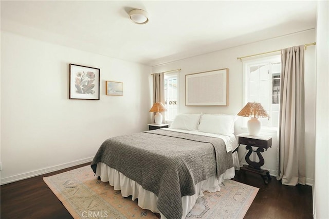 2319 S Corning St, Los Angeles, CA 90034 - bedroom with dark wood-style flooring and baseboards
