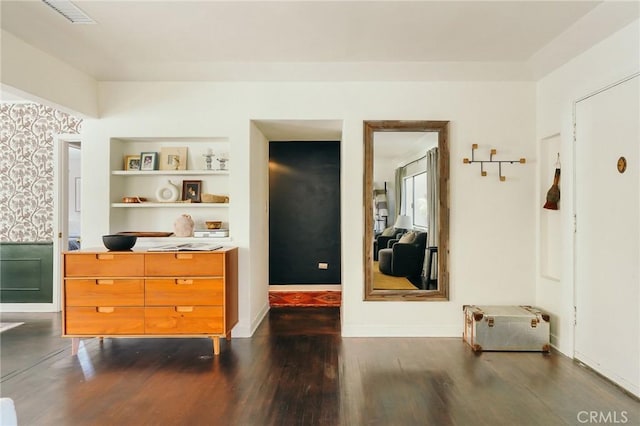 2319 S Corning St, Los Angeles, CA 90034 - interior space with dark wood-style flooring, built in shelves, and baseboards