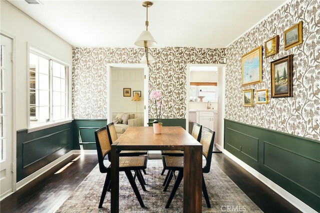 2319 S Corning St, Los Angeles, CA 90034 - dining room featuring wallpapered walls, wainscoting, and dark wood finished floors