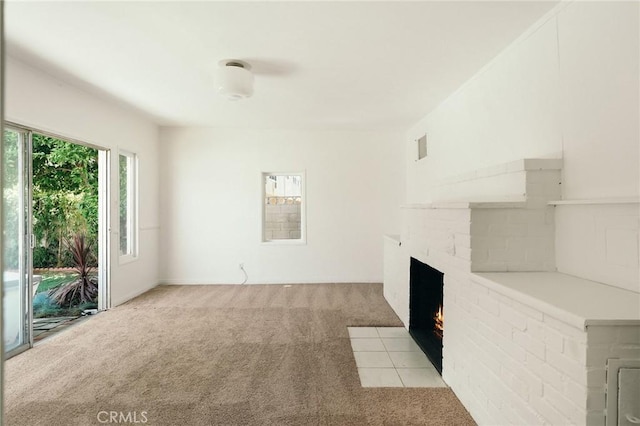 2319 S Corning St, Los Angeles, CA 90034 - unfurnished living room featuring light carpet and a brick fireplace