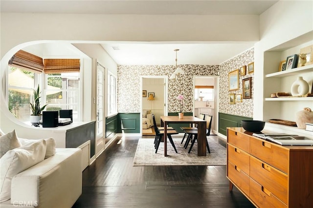 2319 S Corning St, Los Angeles, CA 90034 - dining space with wallpapered walls, a wainscoted wall, and dark wood-style floors