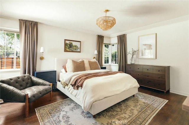 2319 S Corning St, Los Angeles, CA 90034 - bedroom with multiple windows, dark wood-style flooring, and baseboards