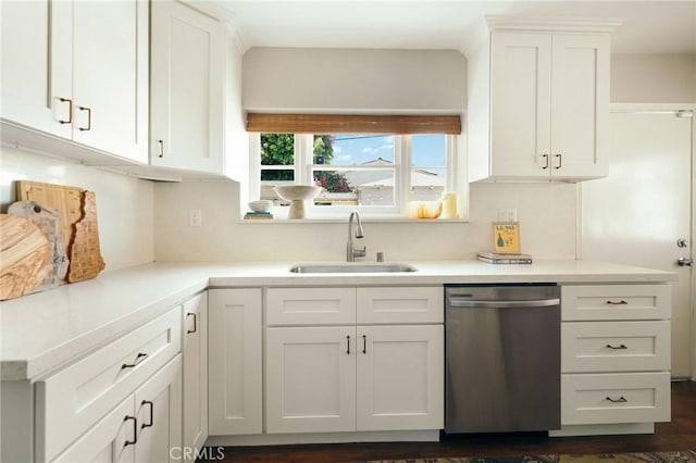 2319 S Corning St, Los Angeles, CA 90034 - kitchen featuring stainless steel dishwasher, a sink, white cabinets, and light countertops