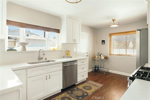 2319 S Corning St, Los Angeles, CA 90034 - kitchen featuring appliances with stainless steel finishes, a sink, plenty of natural light, and dark wood-type flooring