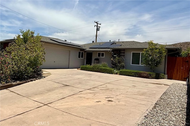 19837 Larbert St, Canyon Country, CA 91351 - ranch-style home with stucco siding, roof mounted solar panels, concrete driveway, and an attached garage