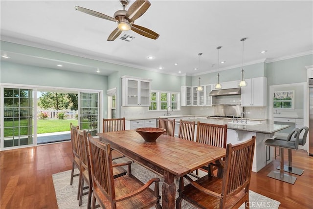 36475 Avenida La Cresta, Murrieta, CA 92562 - dining room with light wood-style floors, ceiling fan, plenty of natural light, recessed lighting, and ornamental molding