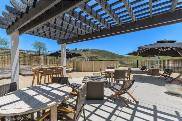 36475 Avenida La Cresta, Murrieta, CA 92562 - fenced backyard featuring outdoor dining space, a pergola, a patio, and a mountain view