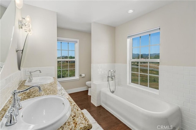 36475 Avenida La Cresta, Murrieta, CA 92562 - full bathroom featuring healthy amount of natural light, wood finished floors, a garden tub, and double vanity