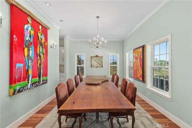36475 Avenida La Cresta, Murrieta, CA 92562 - dining area featuring a chandelier, crown molding, wood finished floors, baseboards, and recessed lighting