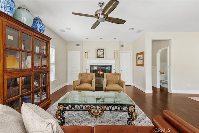 36475 Avenida La Cresta, Murrieta, CA 92562 - living area featuring wood finished floors, baseboards, ceiling fan, a glass covered fireplace, and recessed lighting