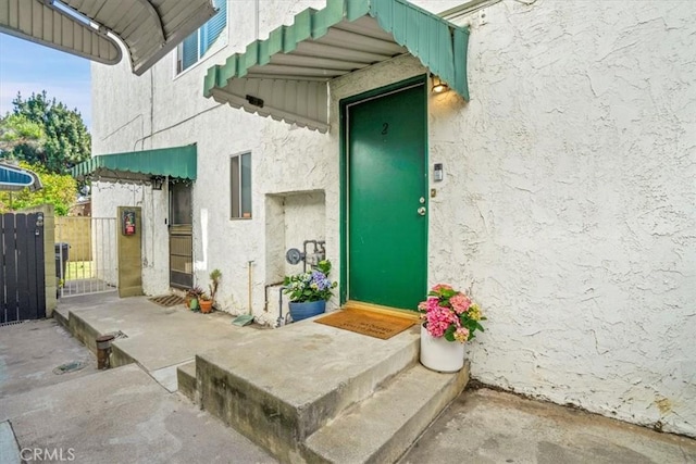 2212 Grant Ave, Redondo Beach, CA 90278 - doorway to property featuring stucco siding and a gate