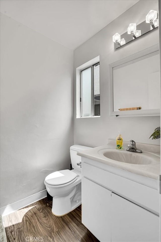 2212 Grant Ave, Redondo Beach, CA 90278 - bathroom featuring vanity, toilet, wood finished floors, and baseboards