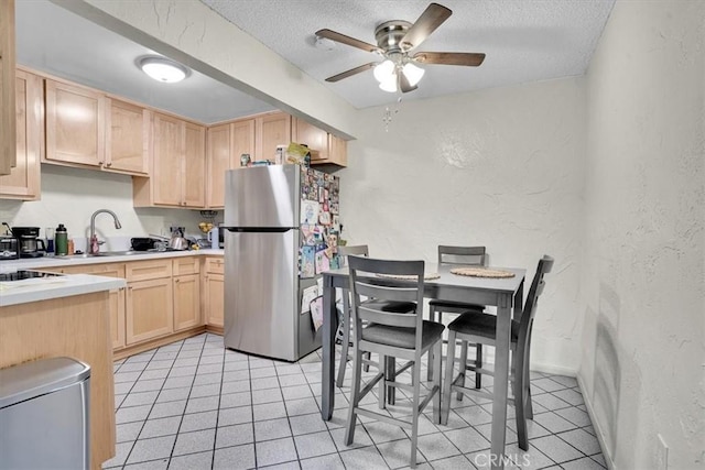2212 Grant Ave, Redondo Beach, CA 90278 - kitchen featuring freestanding refrigerator, light brown cabinetry, a textured wall, ceiling fan, and light countertops