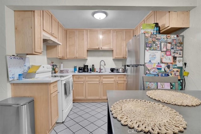 2212 Grant Ave, Redondo Beach, CA 90278 - kitchen with freestanding refrigerator, light brown cabinetry, a sink, and white range with electric cooktop