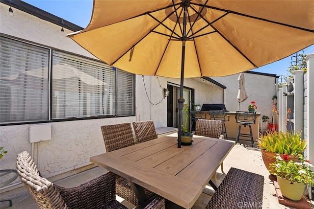 399 N Ironpike Cir Unit 18, Anaheim, CA 92807 - view of patio / terrace featuring exterior kitchen and outdoor dining area