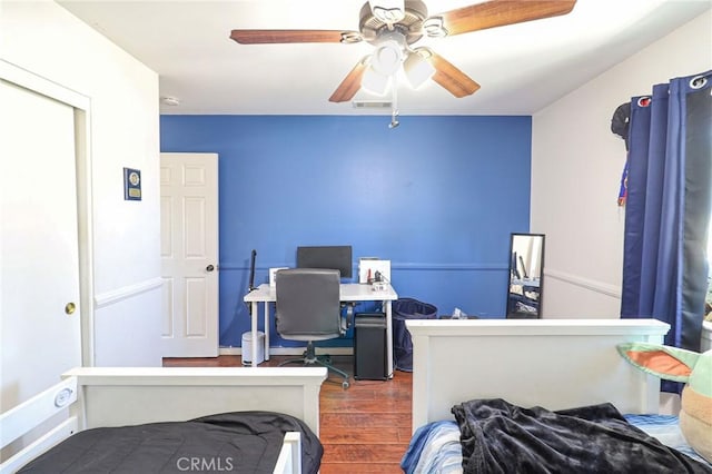 18353 Hackberry St, Hesperia, CA 92345 - bedroom featuring wood finished floors, an office area, and a ceiling fan