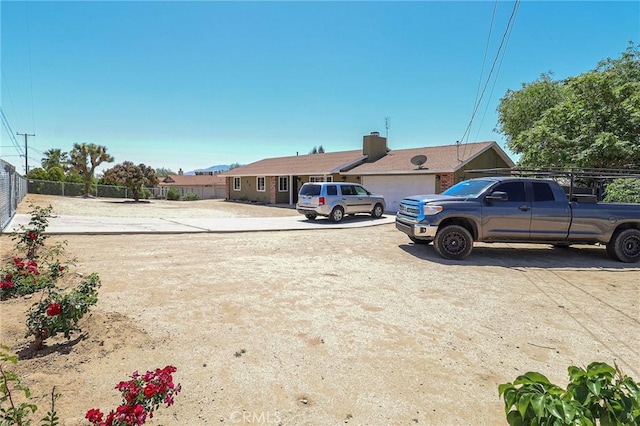 18353 Hackberry St, Hesperia, CA 92345 - view of yard featuring driveway and a garage