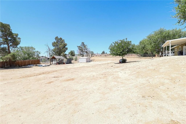 18353 Hackberry St, Hesperia, CA 92345 - view of yard with a storage unit