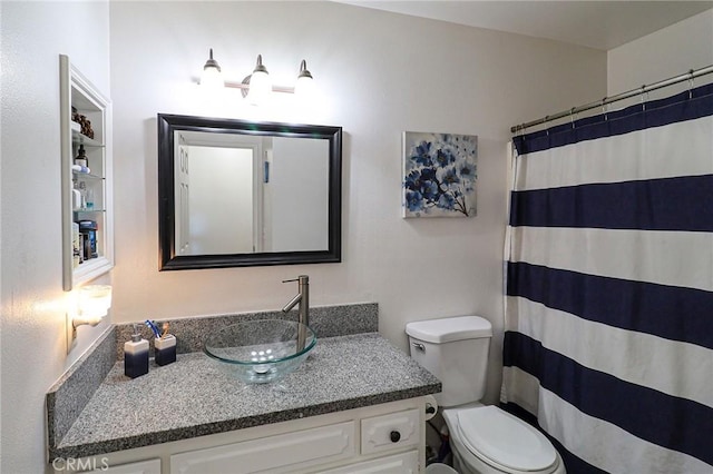 18353 Hackberry St, Hesperia, CA 92345 - full bath featuring toilet, vanity, and a shower with shower curtain