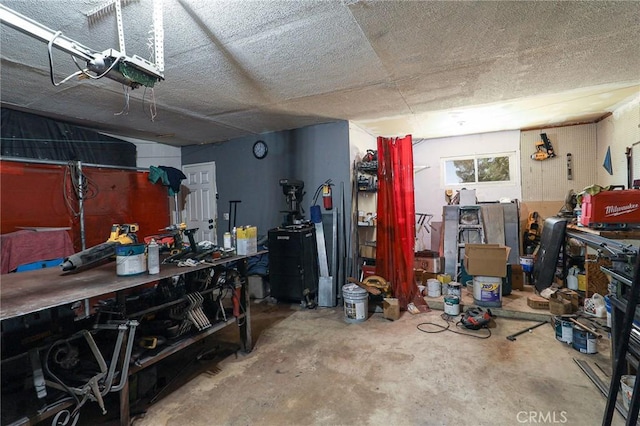 18353 Hackberry St, Hesperia, CA 92345 - garage with a workshop area and a garage door opener