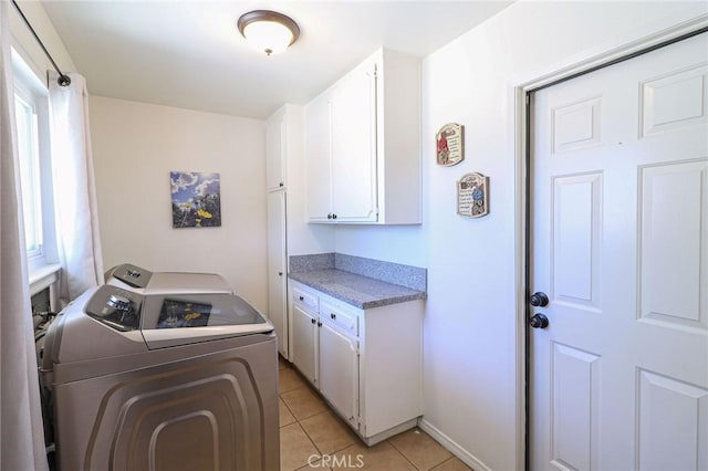 18353 Hackberry St, Hesperia, CA 92345 - washroom featuring washing machine and clothes dryer, cabinet space, light tile patterned flooring, and baseboards