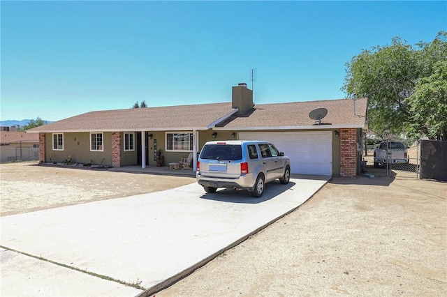18353 Hackberry St, Hesperia, CA 92345 - single story home with concrete driveway, an attached garage, a chimney, and brick siding
