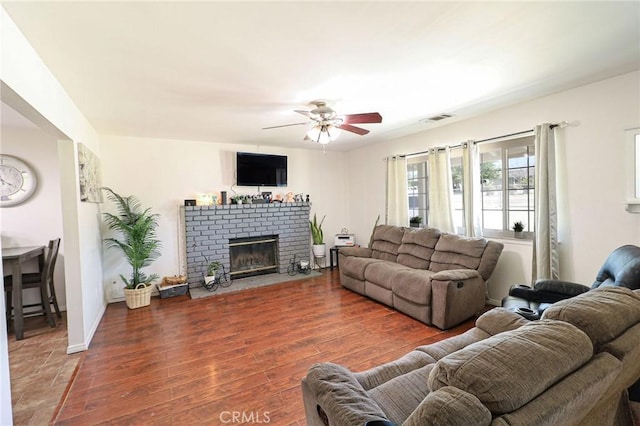18353 Hackberry St, Hesperia, CA 92345 - living area with ceiling fan, wood finished floors, and a brick fireplace