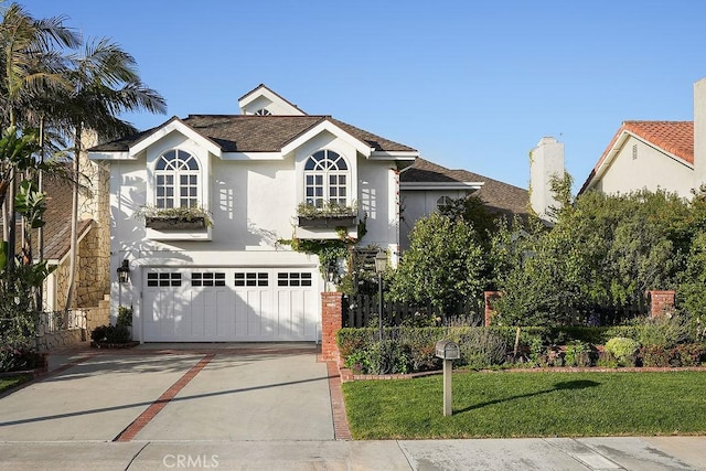 22372 Harwich Ln, Huntington Beach, CA 92646 - traditional-style house featuring stucco siding, concrete driveway, a garage, and a front yard